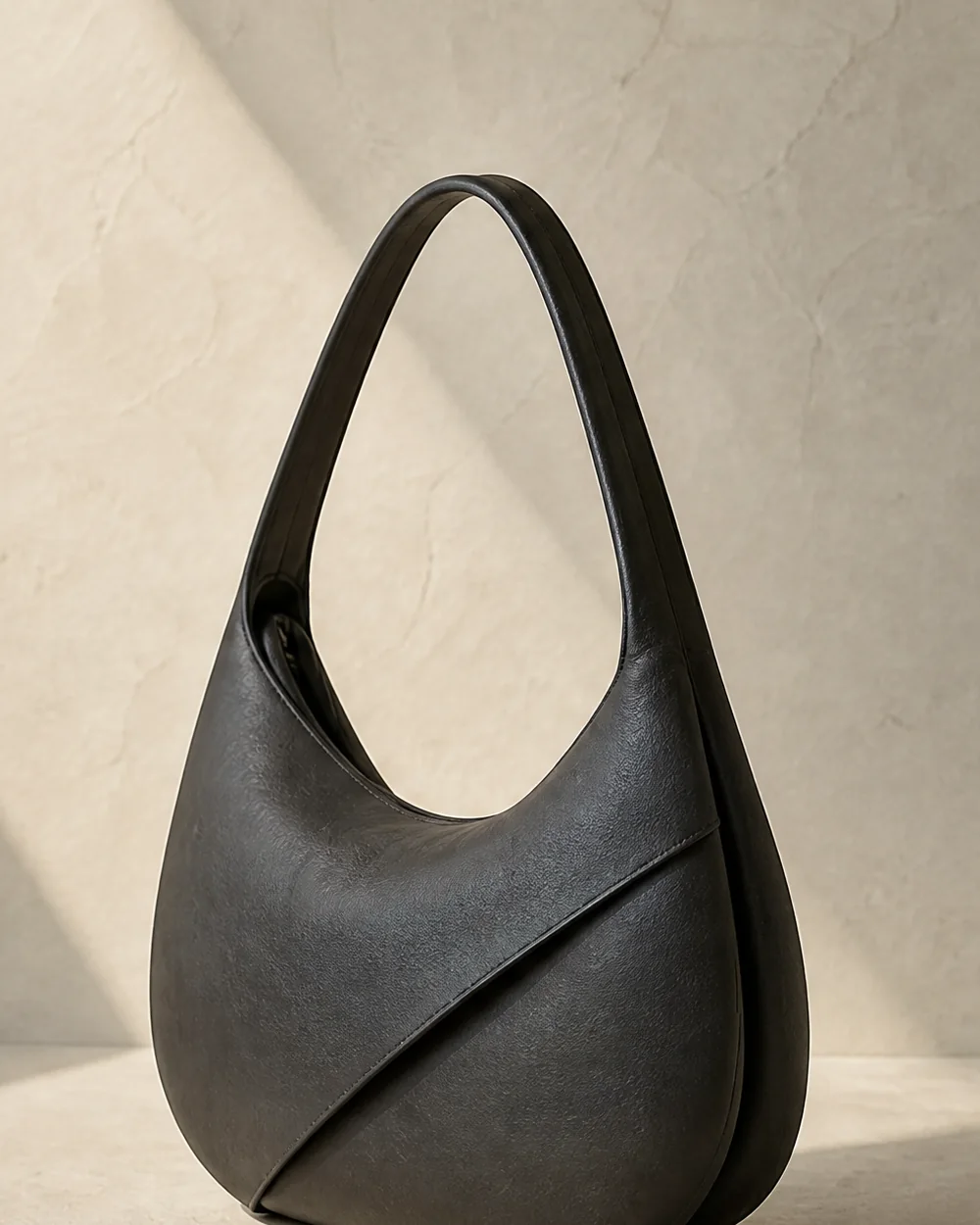 Aural Crescent Shoulder Bag in ink, side view