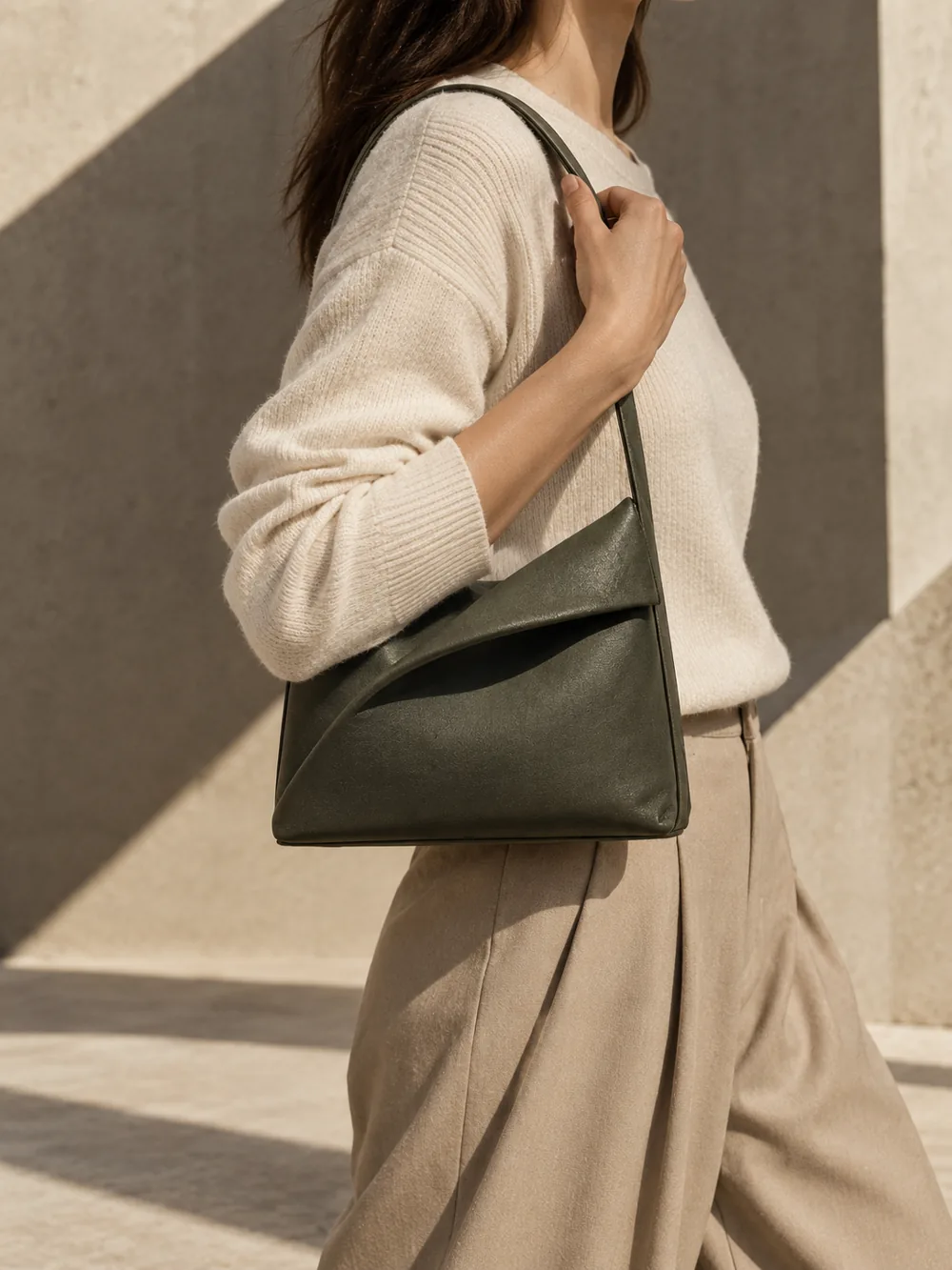 Vela Ridge Shoulder Bag in olive worn with a tailored outfit