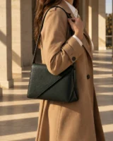 Offset Panel Shoulder Bag in forest worn with a tailored outfit