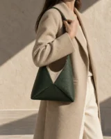 Tessel Three-Panel Shoulder Bag in deep forest worn with a tailored outfit