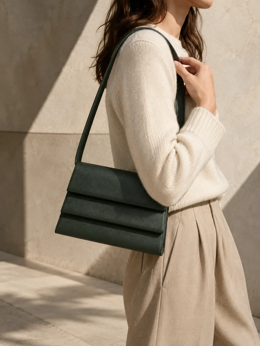 Cadence Stepped Shoulder Bag in forest worn with a tailored outfit