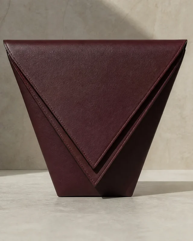 Lamina Double-Edge Clutch in oxblood, front view