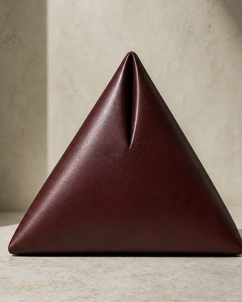 Apex Triangle Clutch in oxblood, front view