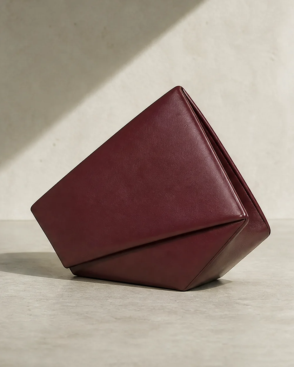 Kite Diamond Clutch in oxblood, side view