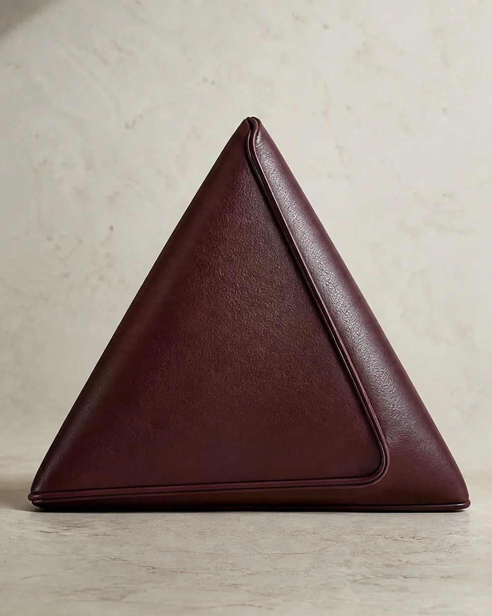 Edgework Triangle Clutch in oxblood, front view