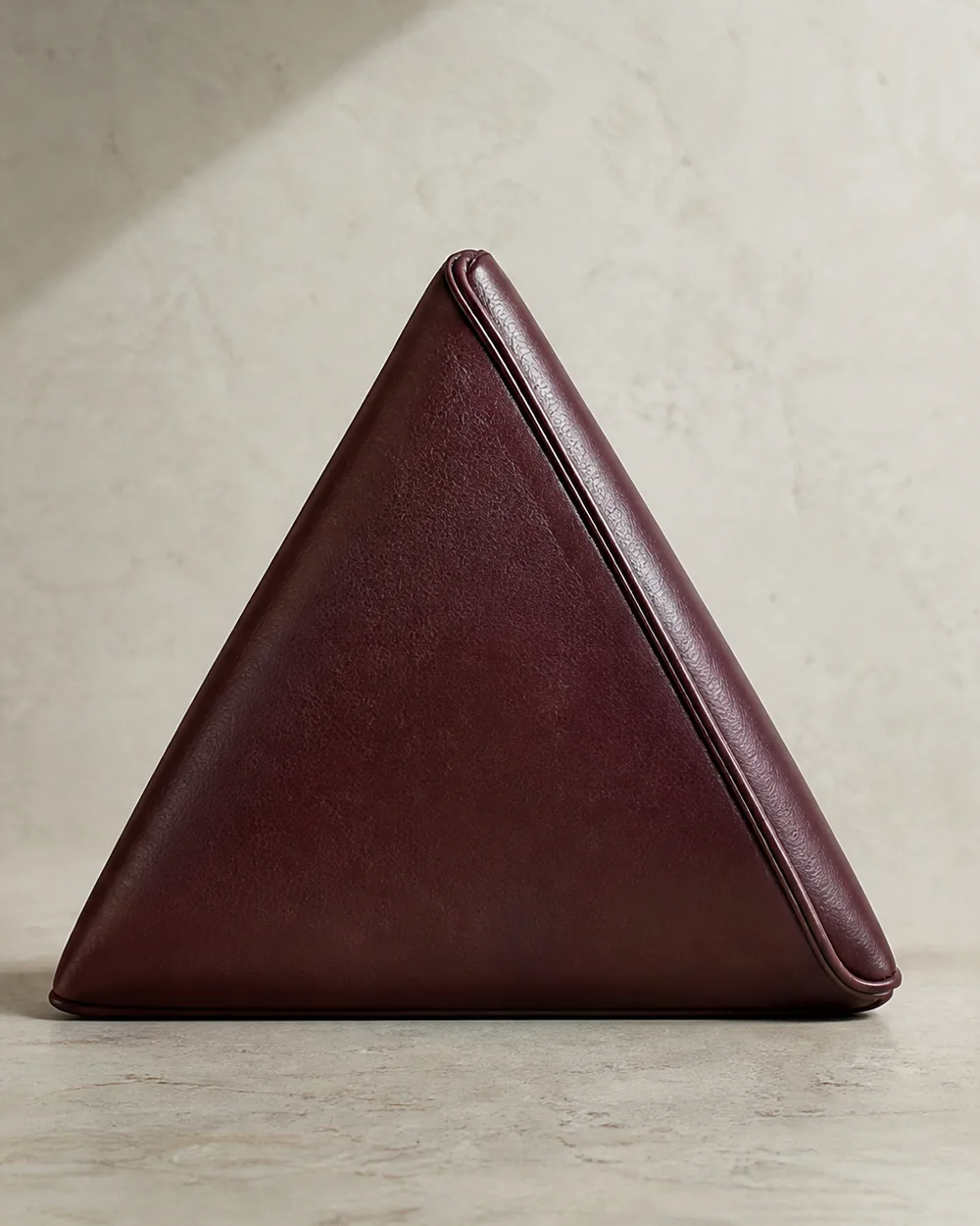 Edgework Triangle Clutch in oxblood, back view
