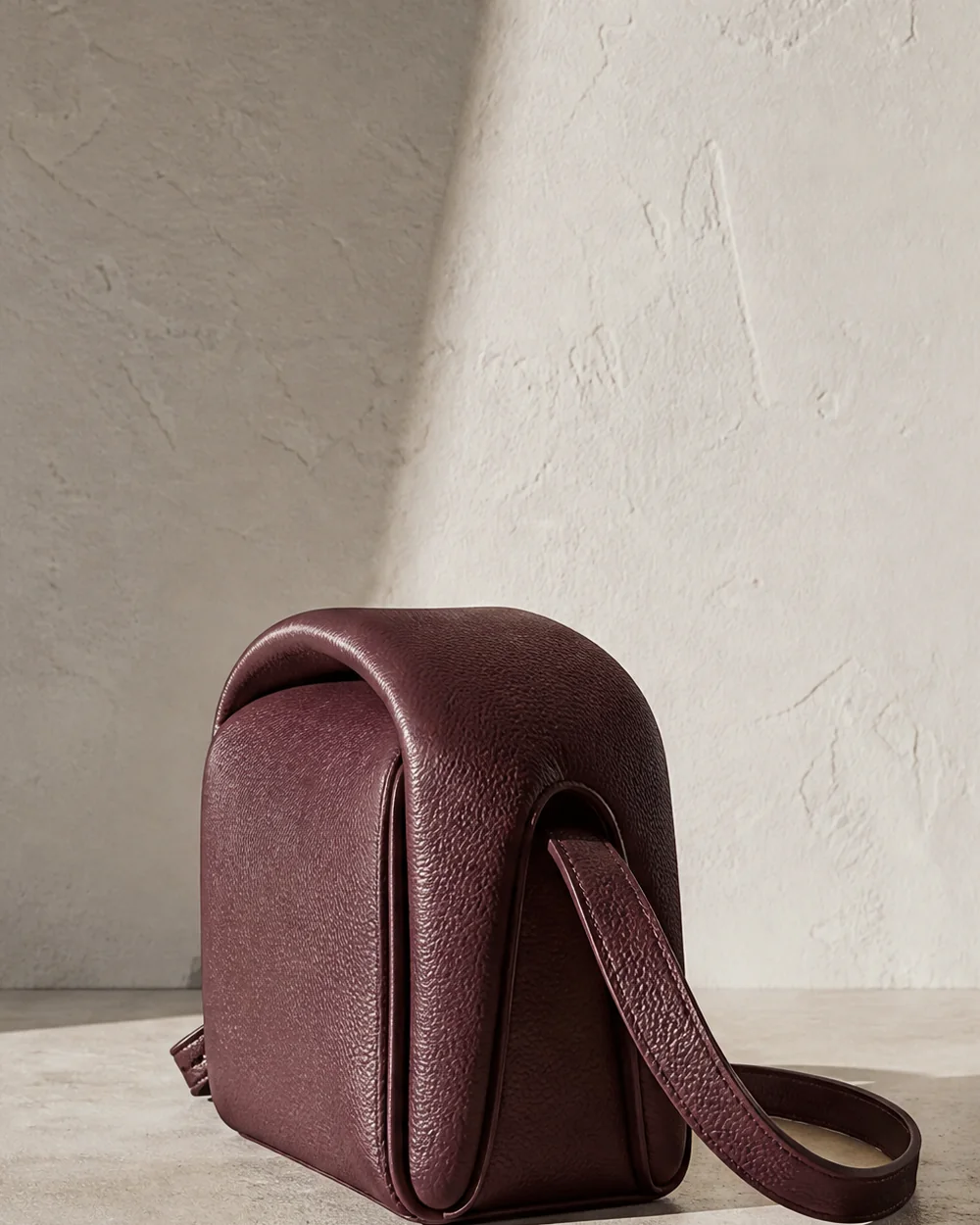 Portico Arch Crossbody in oxblood, side view
