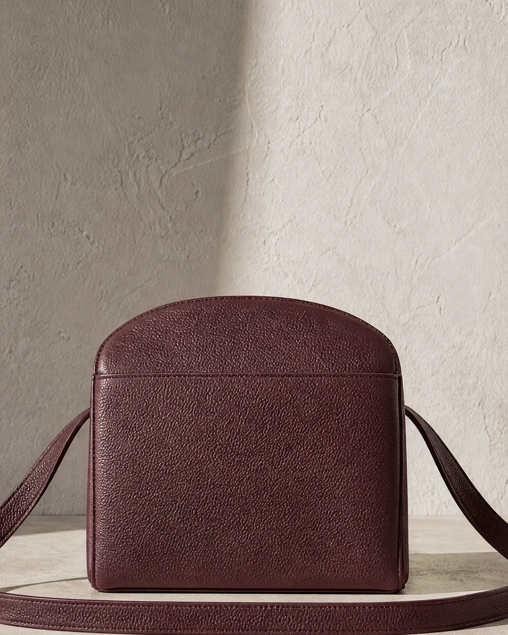 Portico Arch Crossbody in oxblood, back view