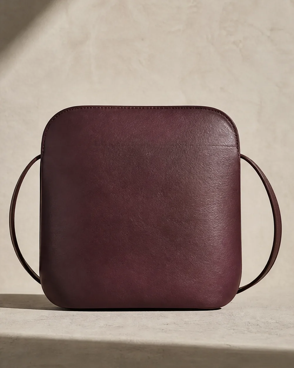 Turn Crossbody in plum, back view