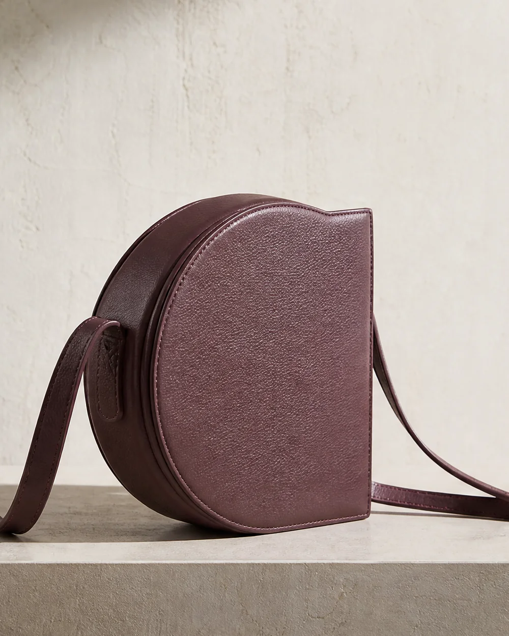 Orbit Crossbody in plum, side view