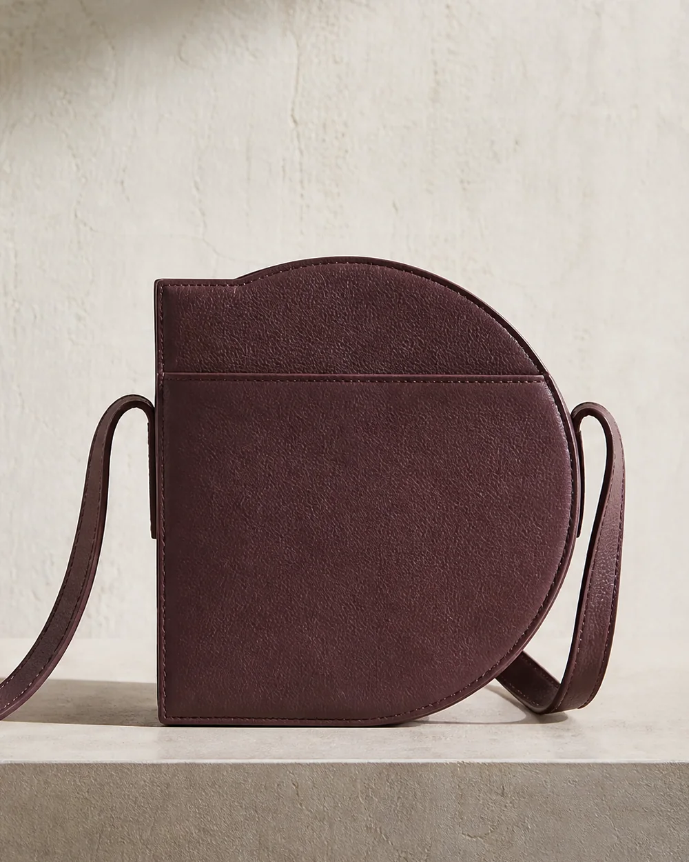 Orbit Crossbody in plum, back view