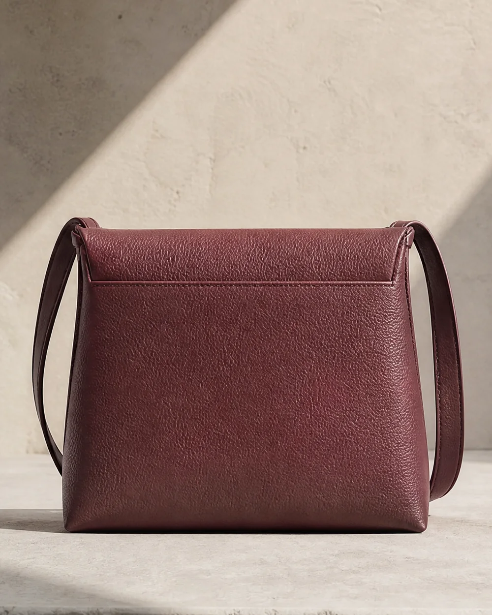 Angle Nested Crossbody in plum, back view