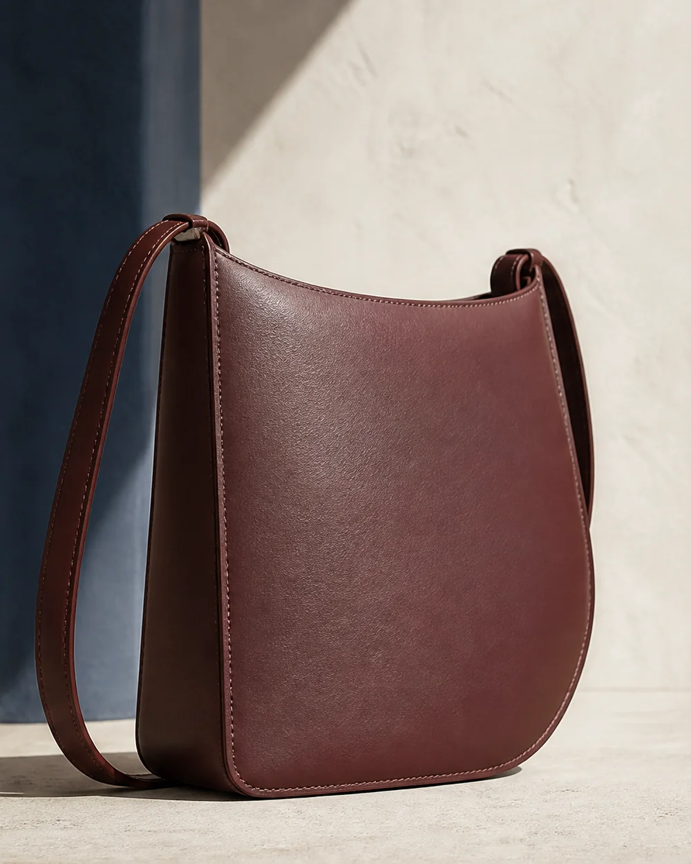Silhouette Crossbody in oxblood, side view