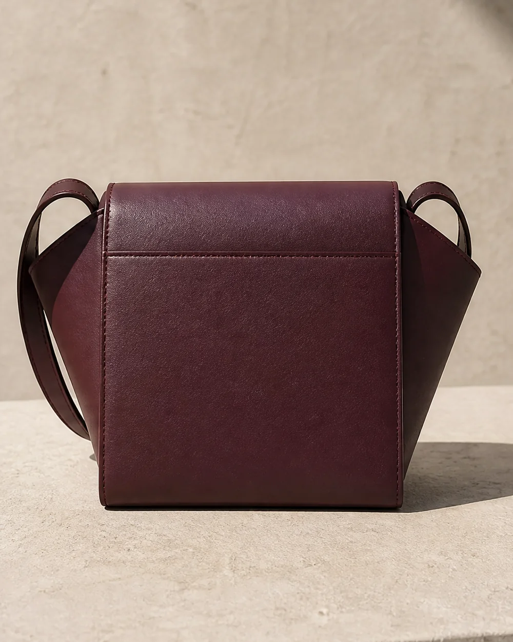 Graft Crossbody in plum, back view