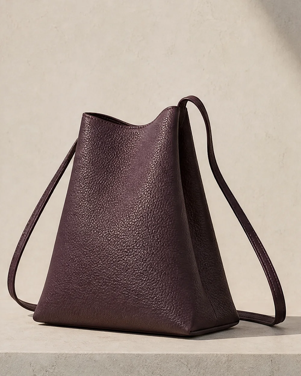 Lantern Crossbody in plum, side view