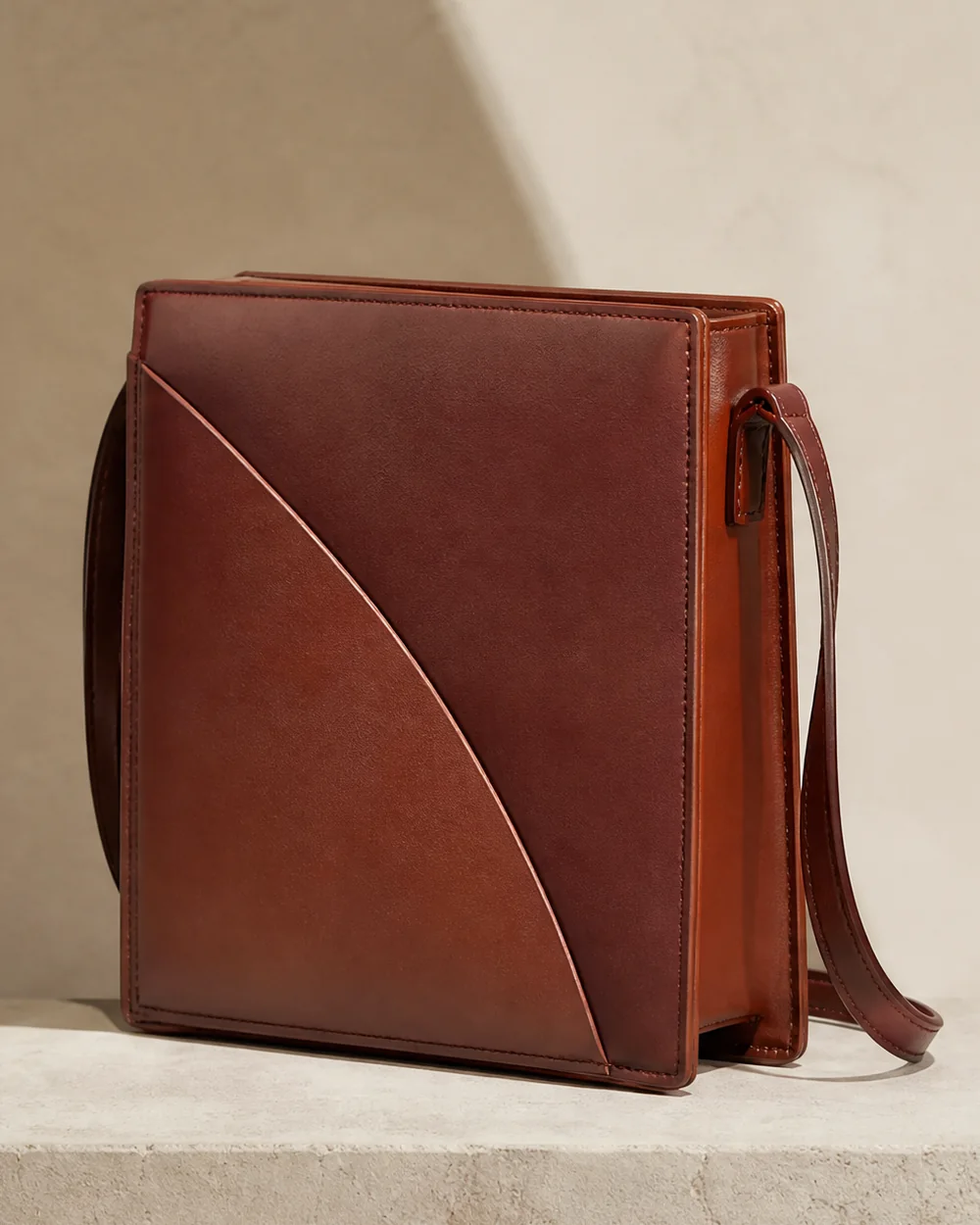 Bracket Crossbody in sienna, side view