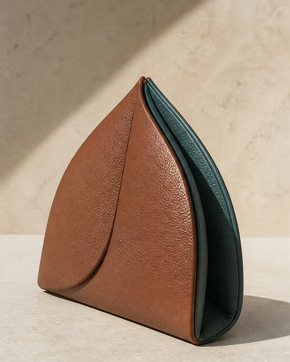 Leaf Pouch in terracotta / teal, side view