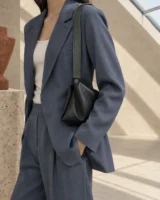 Span Folded Strap in deep forest worn with a tailored outfit