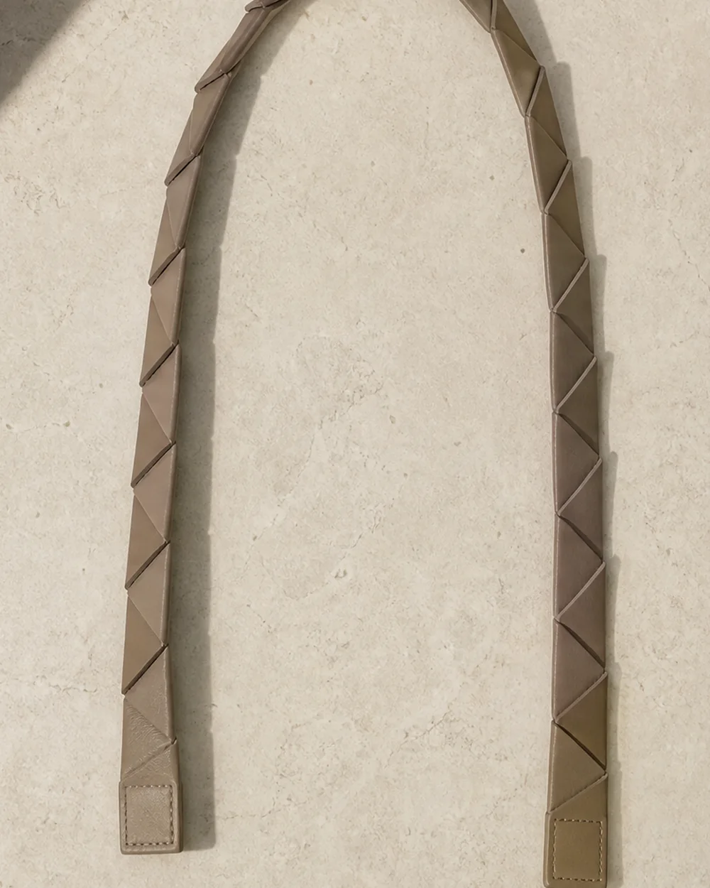 Tension Segmented Strap in stone, front view