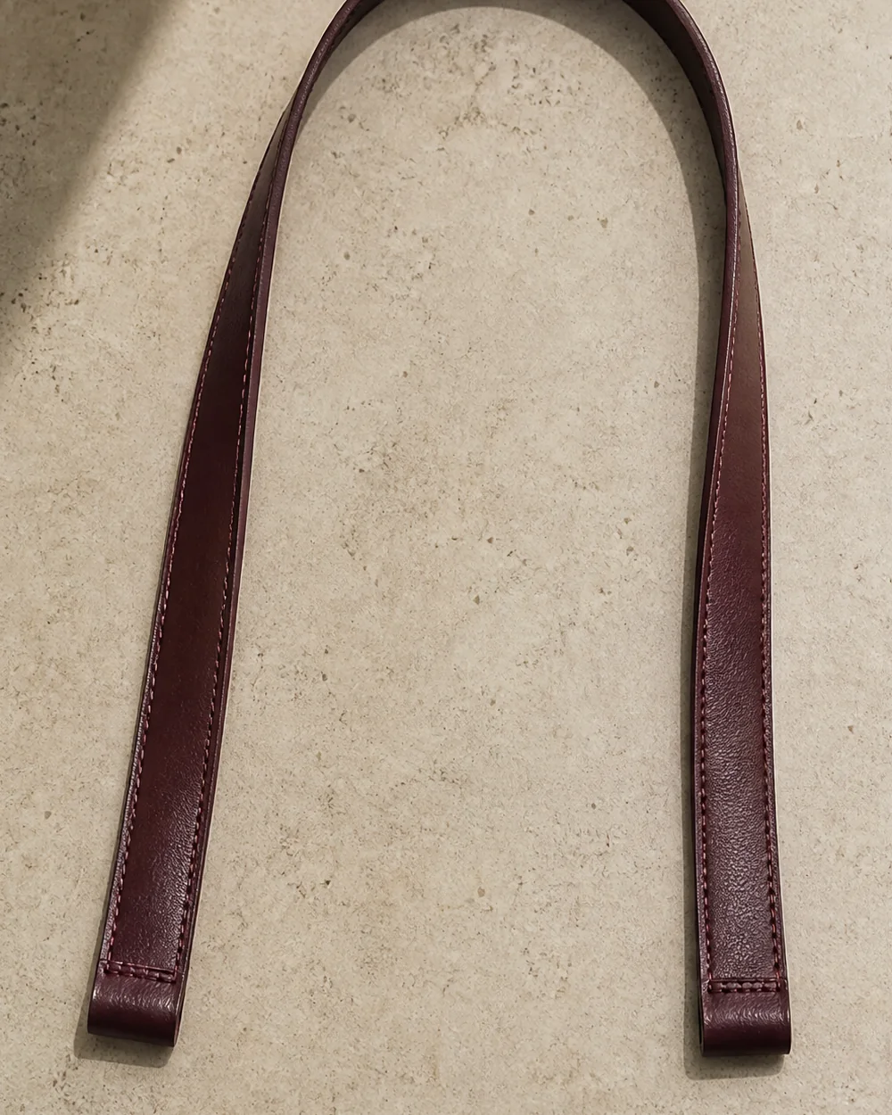 Continuity Strap in oxblood, front view